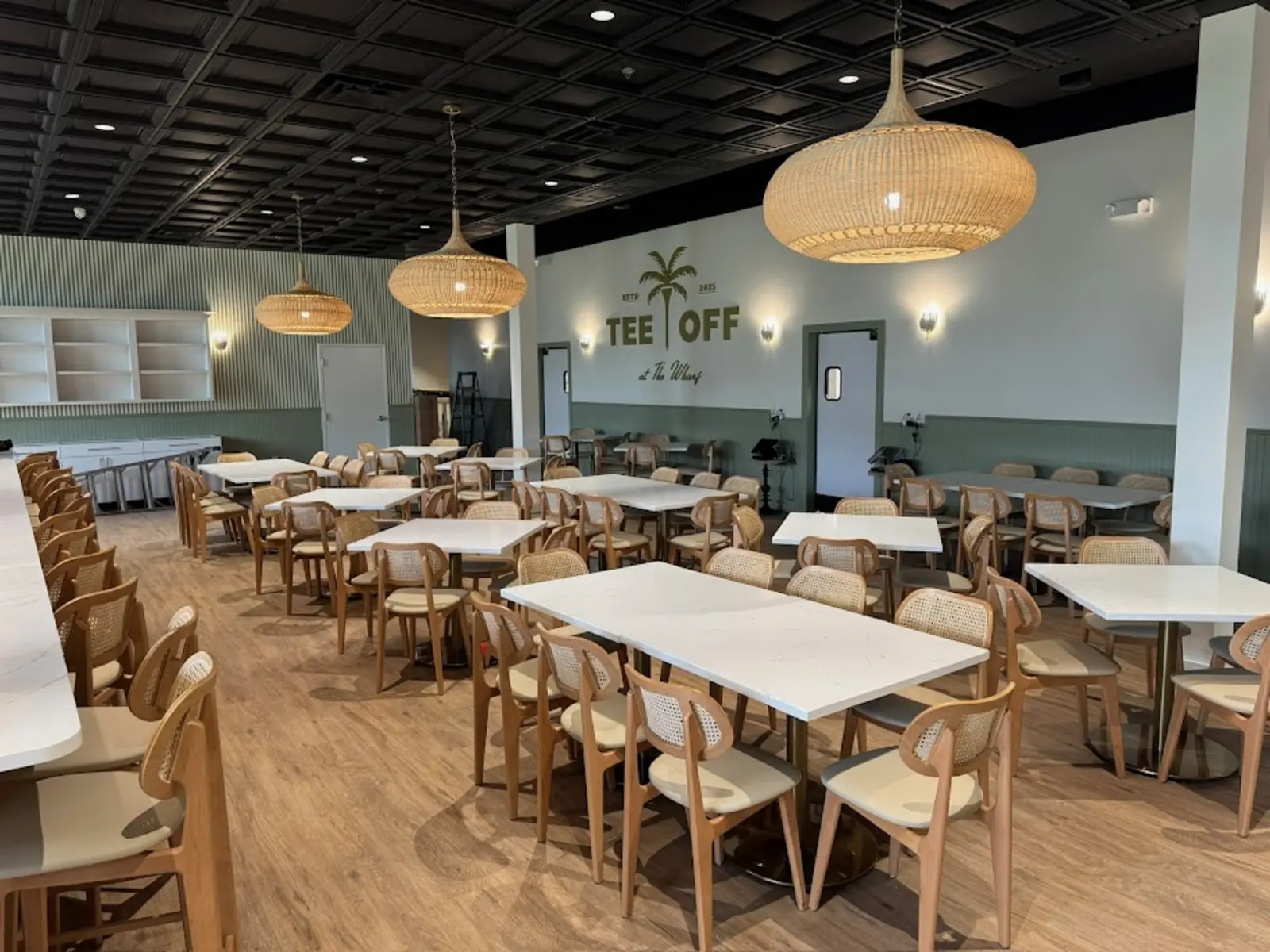 The dining room at Tee Off at The Wharf, set and empty before service