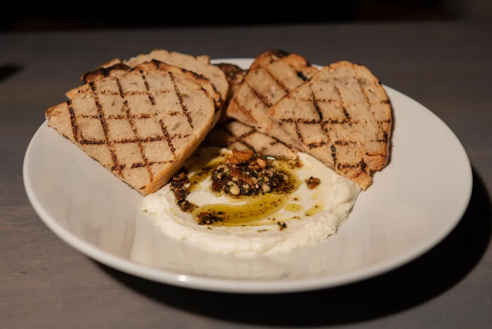 Whipped dip with grilled bread, served at Tee Off at The Wharf