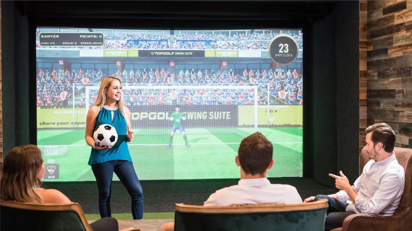 Soccer on the simulator screen at Tee Off at The Wharf